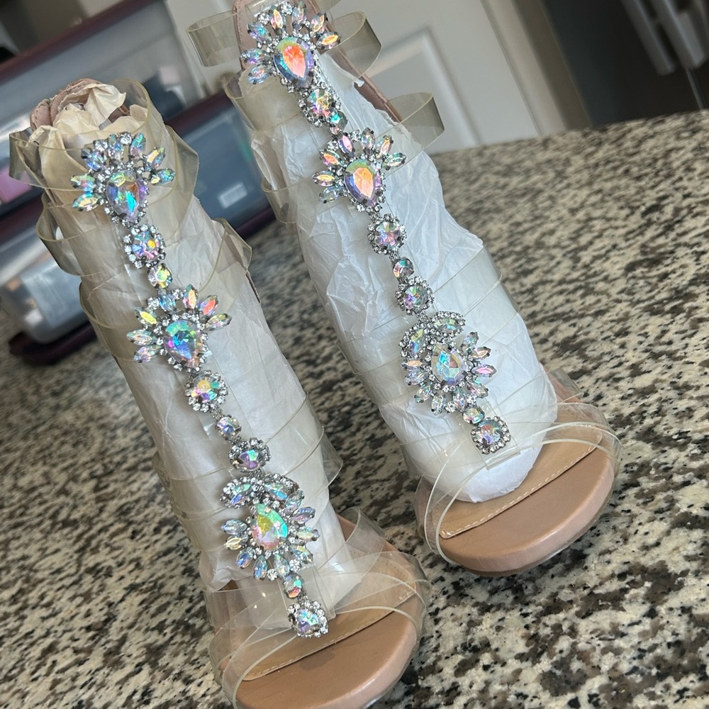 Beautiful new never worn 4” heels clear straps with silver bling